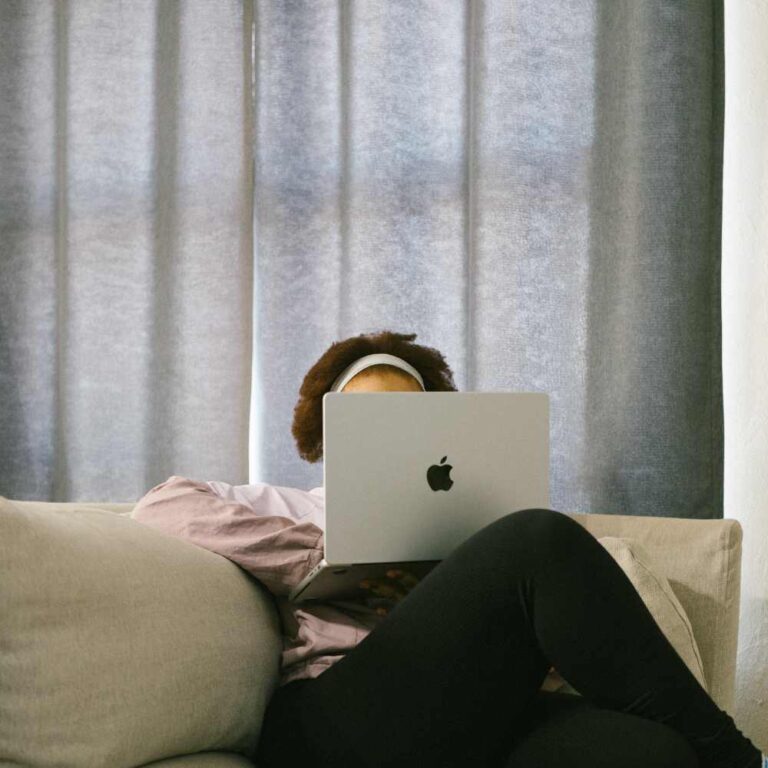 girl holding laptop